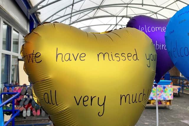Staff at Thomas A'Becket Infant School in Worthing welcomed children back to school today with balloons and banners.