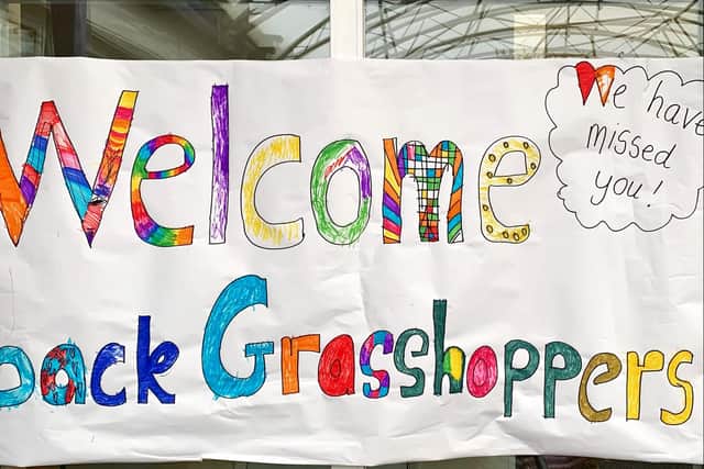 Staff at Thomas A'Becket Infant School in Worthing welcomed children back to school today with balloons and banners.