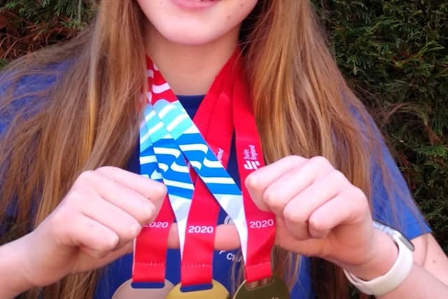 Hannah Day wih her medals