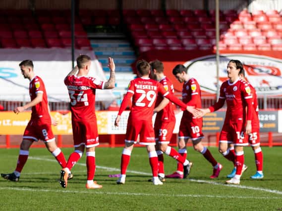 Reds players celebrate one of Tom Nichols' recent goals