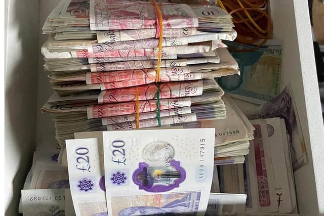 Cash seized by police. Picture from Sussex Police