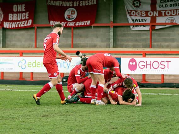 Reds players mob matchwinner James Tilley. Picture by UK Sports Images Ltd/Jamie Evans