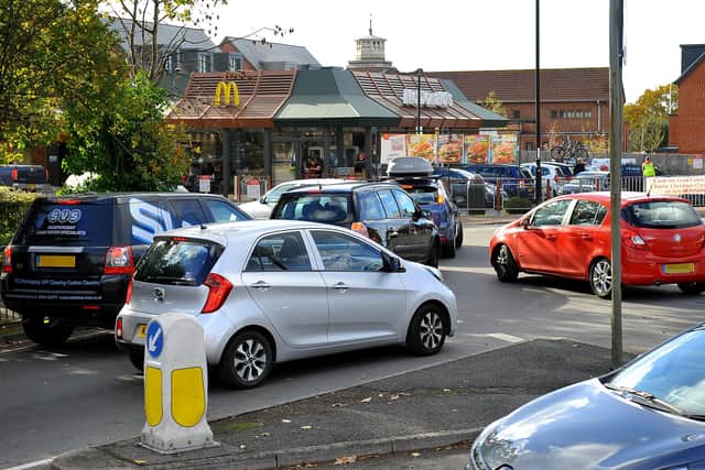 Traffic queueing to enter McDonalds drive thru in Burgess Hill is causing problems on the roundabout outside. Picture by Steve Robards