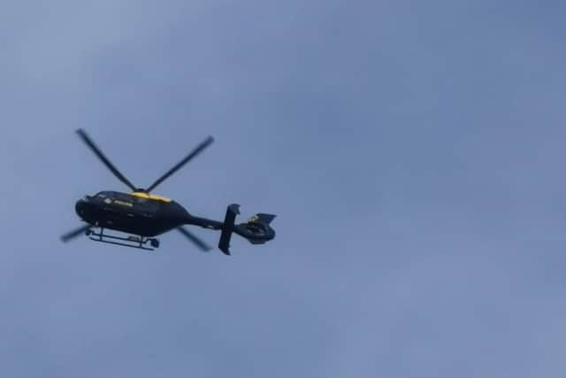 The police helicopter over Bexhill on Saturday. Picture: Andrew Crotty SUS-210316-133854001