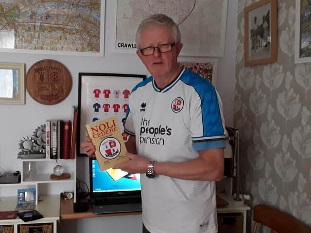Crawley Town fan Steve Leake with his new book