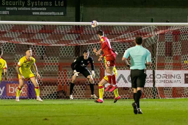 Ashley Nadesan wins a header. Picture by UK Sports Images Ltd/Jamie Evans
