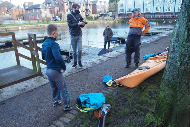 Billy Monger on the pontoon at Chichester Canal with his coach during training for his Comic Relief challenge. Photo by Janet Osborne