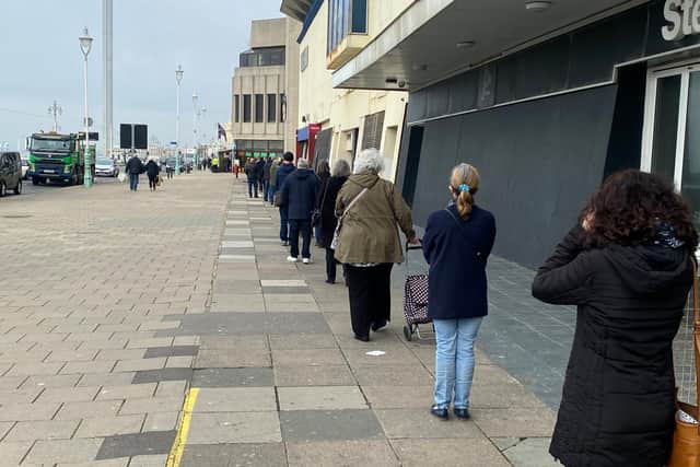 People waiting in line for their vaccine outside the Brighton Centre this week