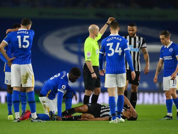 Isaac Hayden was injured in the first half after an accidental collision with Yves Bissouma