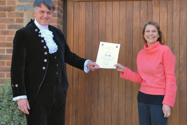 Dr Tim Fooks, High Sheriff of West Sussex, presents a Special Recognition Volunteer Award to Lizzie Smith in honour of her late husband, Peter Smith