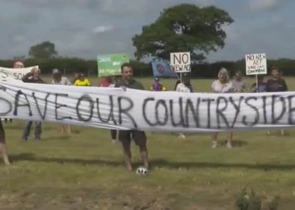 Campaigners during a socially-distanced protest last summer