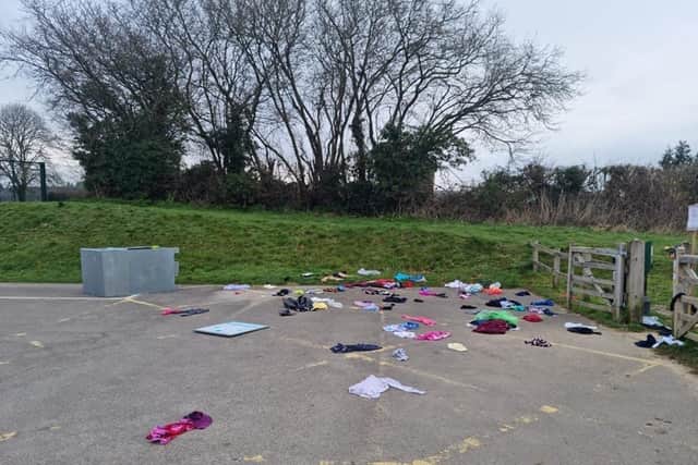 Clothing items meant to go to charity were left strewn across the park