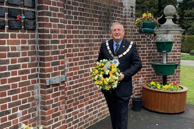 East Grinstead's town mayor John Dabell is laying a wreath at the Memorial Wall in Mount Noddy Cemetery. Picture: East Grinstead Town Council