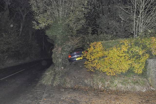 A vehicle crashed into a hedge on the road