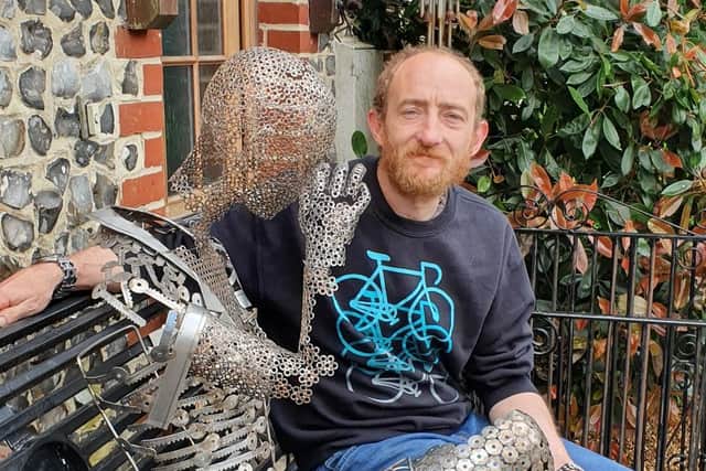 John Gillespie with his sculpture, Unity