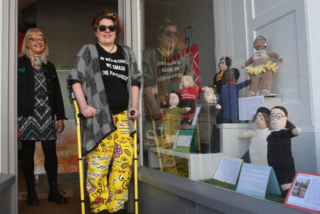 Knitting artist Evie Martin and Ginny Cassell, head of Worthing charity Storm, by the International Women's Day display. Picture: Derek Martin DM21030172a