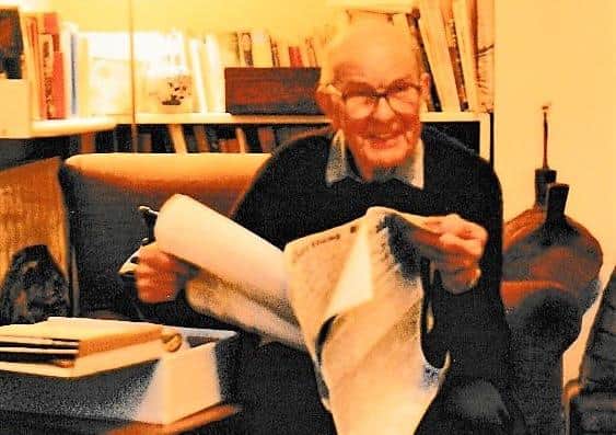 Edward Girling Fowler in 1989, at the age of 80, reading a facsimile of the Worthing Herald editions for June 13, 1931, and May 21, 1932