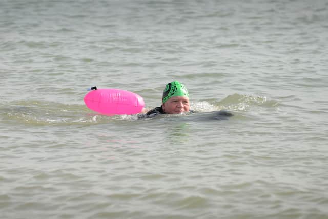 Annemarie Field tries out sea swimming. SUS-210324-130216001