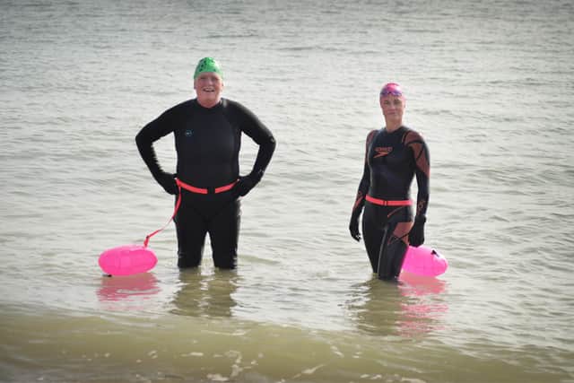 Annemarie Field tries out sea swimming.Annemarie (left) pictured with Dee Harmer, Sussex Open Water Swimming & Coaching (Fish 2 Water). SUS-210324-130429001