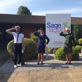 Dementia Support staff dressed up in vintage gear outside Sage House