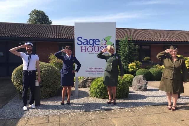 Dementia Support staff dressed up in vintage gear outside Sage House