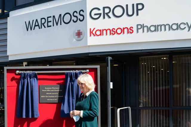 Her Royal Highness unveiling a plaque to officially open the Kamsons Pharmacy and offices