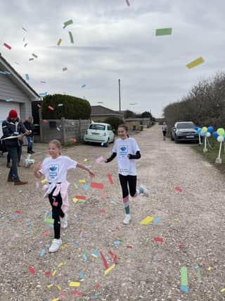 Sophia and Charlotte cross the finishing line on their last day. Photo by Kirstee Porter