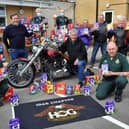 The 1066 Chapter Harley-Davidson Owners Club delivers hundreds of chocolate Easter eggs to Worthing Ambulance Station and is welcomed by TV and radio sports presenter John Inverdale. Picture: Steve Robards SR2104025
