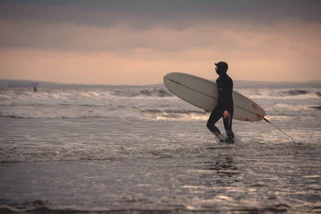 Surfing is just one activity you can enjoy in the Chichester district (Photography by Christopher Lanaway) SUS-210104-183001001