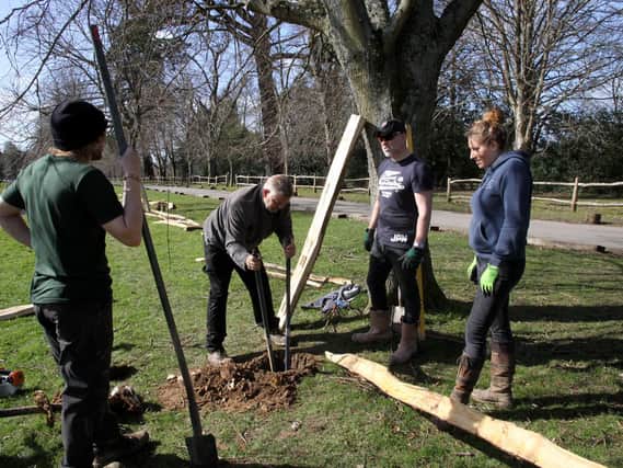 Volunteers at Buxted Park work on the ground's boundary fence / Picture: Ron Hill