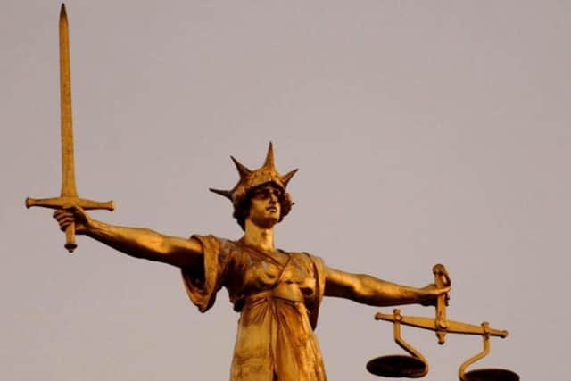 Scales of Justice for court page SUS-210504-113442001