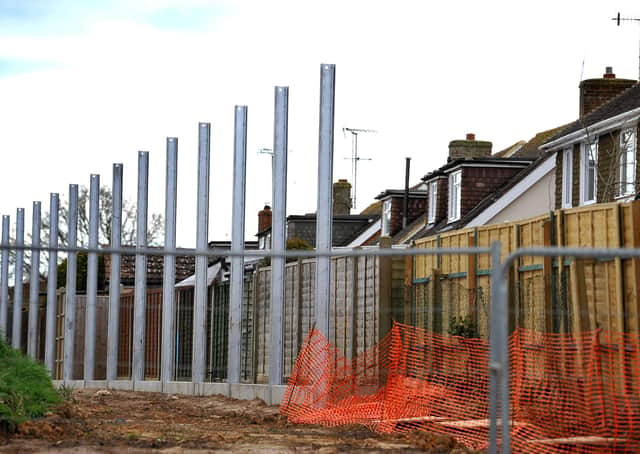 The fence posts are already in place behind the properties in Highdown Drive. Photo by Steve Robards