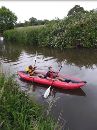TJ and Tommy Schofield kayaking at Barcombe Mills last year