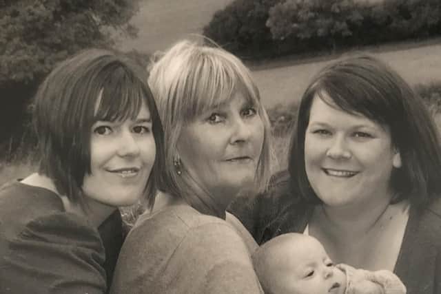 Rosie Ball with one of her grandchildren and her daughters, Vanessa and Sarah
