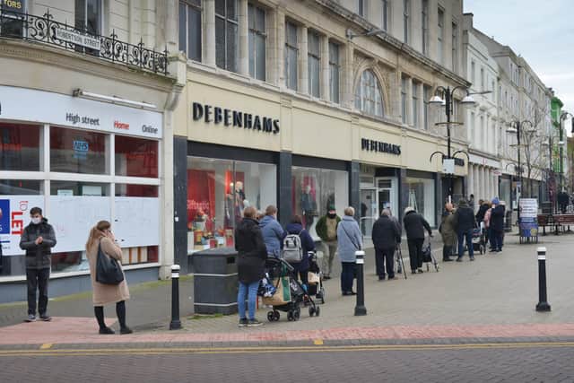 Hastings town centre pictured at the end of England's second lockdown on 2/12/20.

Queue for Debenhams SUS-200212-143524001