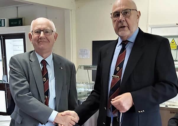 President Paul Bradley handing over the chain of office to new president Deryck Wright