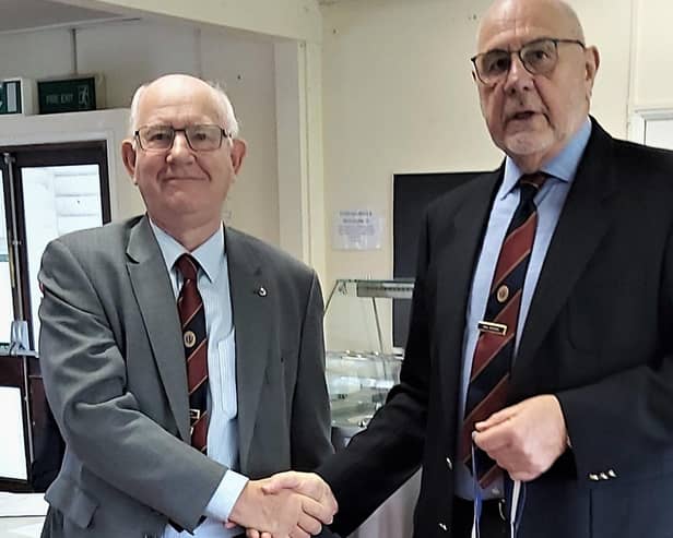 President Paul Bradley handing over the chain of office to new president Deryck Wright