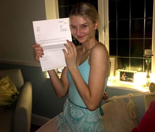 Bo Coles with her acceptance letter from Laine