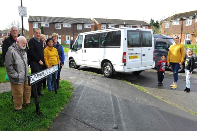 Councillor Simon Hicks (middle left) and concerned residents next to the vehicle. Picture: Steve Robards
