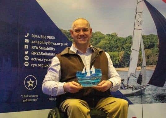 Andy Beadsley, director of The Wheelyboat Trust, with the #MoreThanSailing award - Picture: RYA