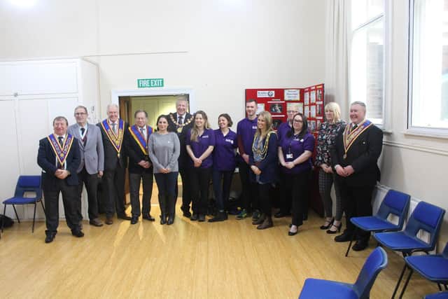 Members of the Provincial Grand Lodge of Mark Master Masons of Sussex with Sussex Homeless Service staff and volunteers and the Mayor of Brighton, Cllr Alexandra Phillips.