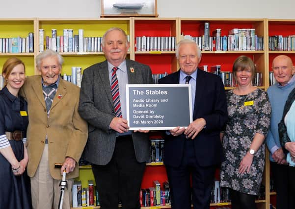 David Dimbleby joins staff, volunteers and blind veterans to open the new library