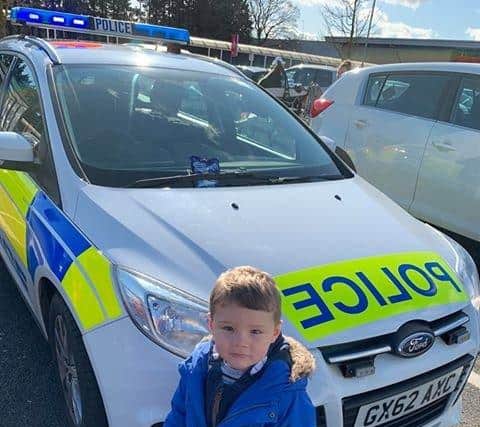 The 'Hit the Ambulance' game has arrived in our area. Noah Barnard, five, from Littlehampton, with the police car in the Tesco Durrington car park