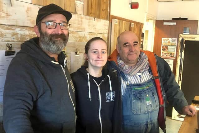 Rick Wood, Wood Store supervisor, Caitlin O'Callaghan, general assistant, and Paolo Roggero, volunteer supervisor