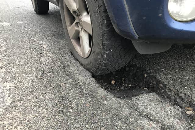 The husband of a Singleton motorist, whose tyre was ‘burst’ by a pothole last month, has spoken of his frustration with the county council’s highways department’s response. SUS-200603-164236001