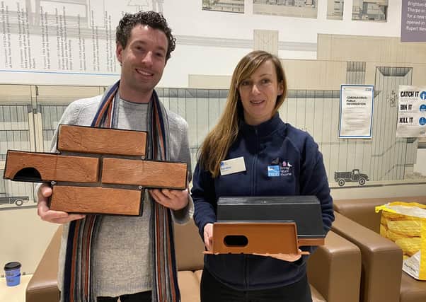 Robert Nemeth with RSPCA volunteer Karolina Roszkowska with two different types of swift box
