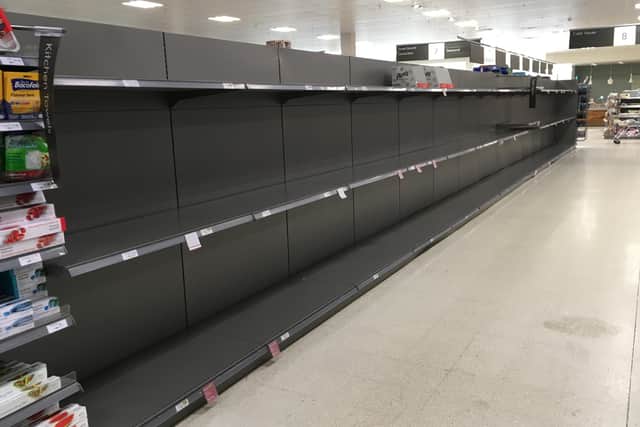 The empty toilet roll aisle in Waitrose, pictured on Saturday.