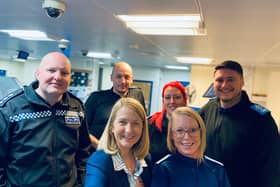 Mrs Bourne (front second from left) and Acting Chief Inspector Mark Evans (first left) with the Crawley Police Station custody team