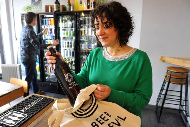 Gemma Clegg and Gareth Harries in Beer No Evil, their shop / beer bar in Worthing. Picture: Steve Robards SR2003062