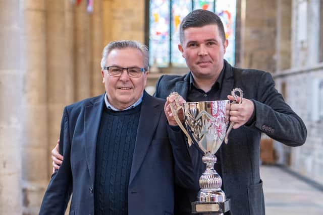 Pip and Joe Turner from Turner's Pies with the supreme champion trophy at the 12th annual British Pie Awards at St Mary's Church in Melton Mowbray. Picture: Martin Elliot